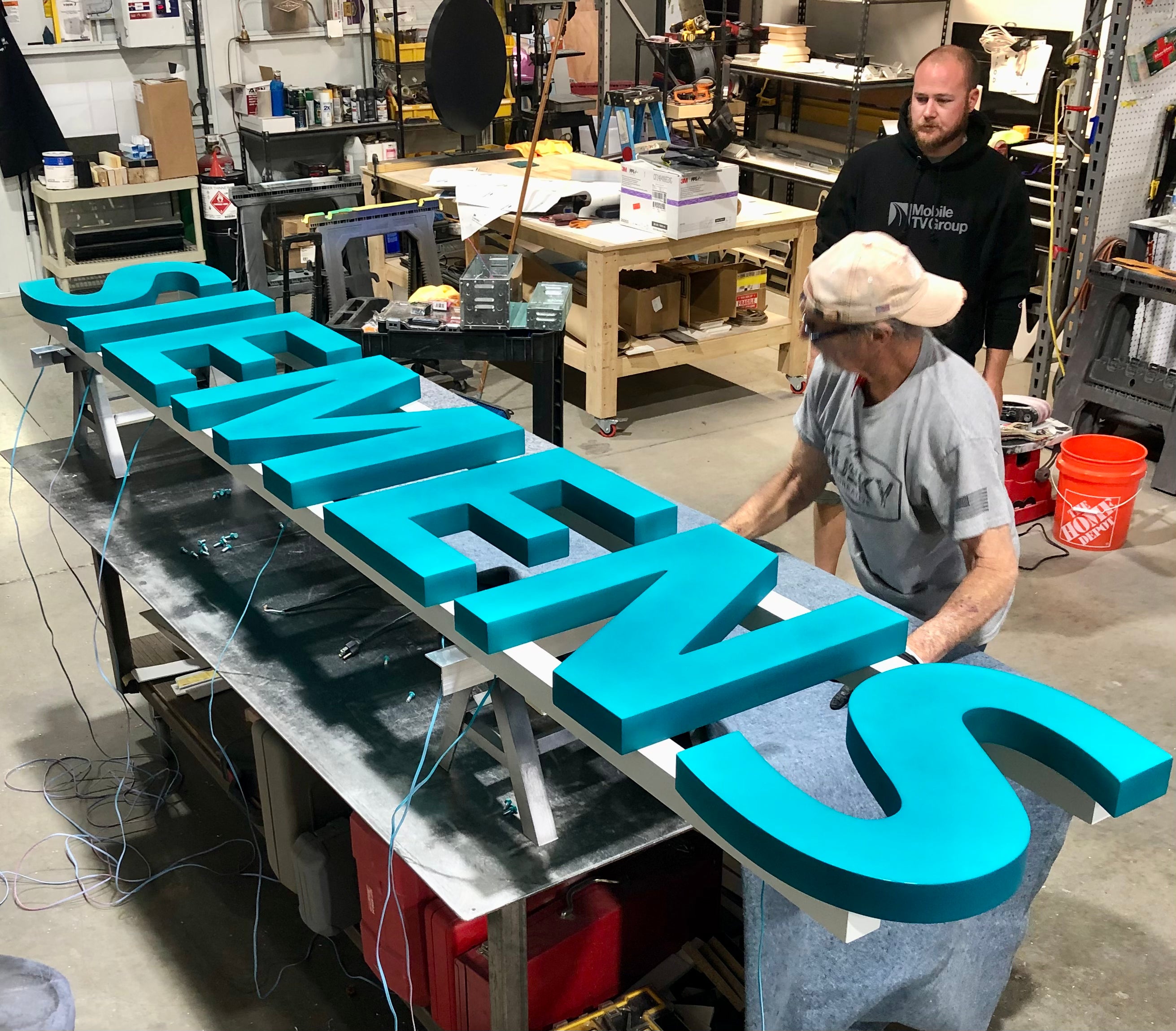 Siemens In-progress fabricated business signage.