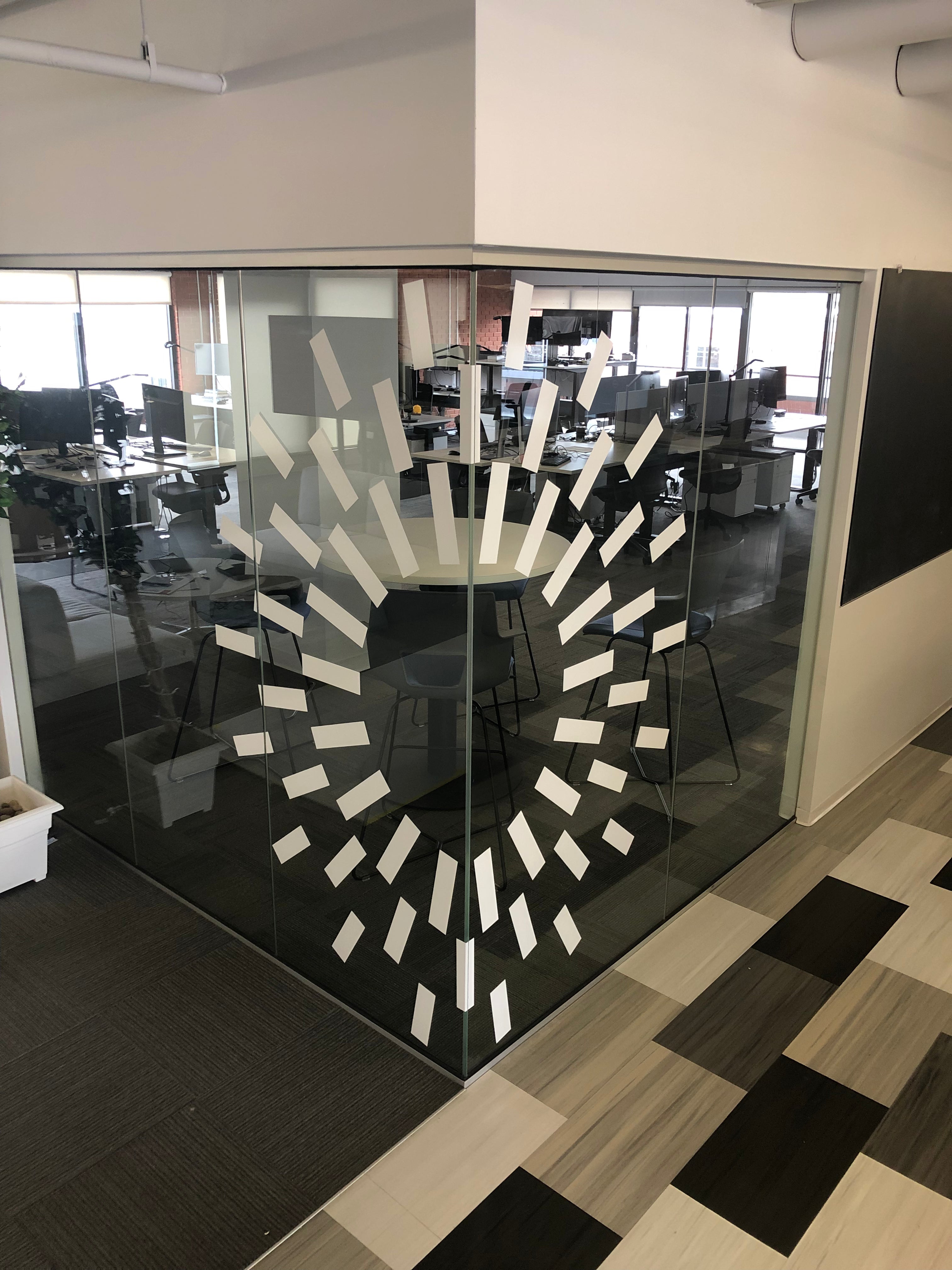 A custom frosted glass wrap for a business inside of Denver, Colorado. Utilizing snippets of the frosted glass to create a unique decision, tailored to their brand.