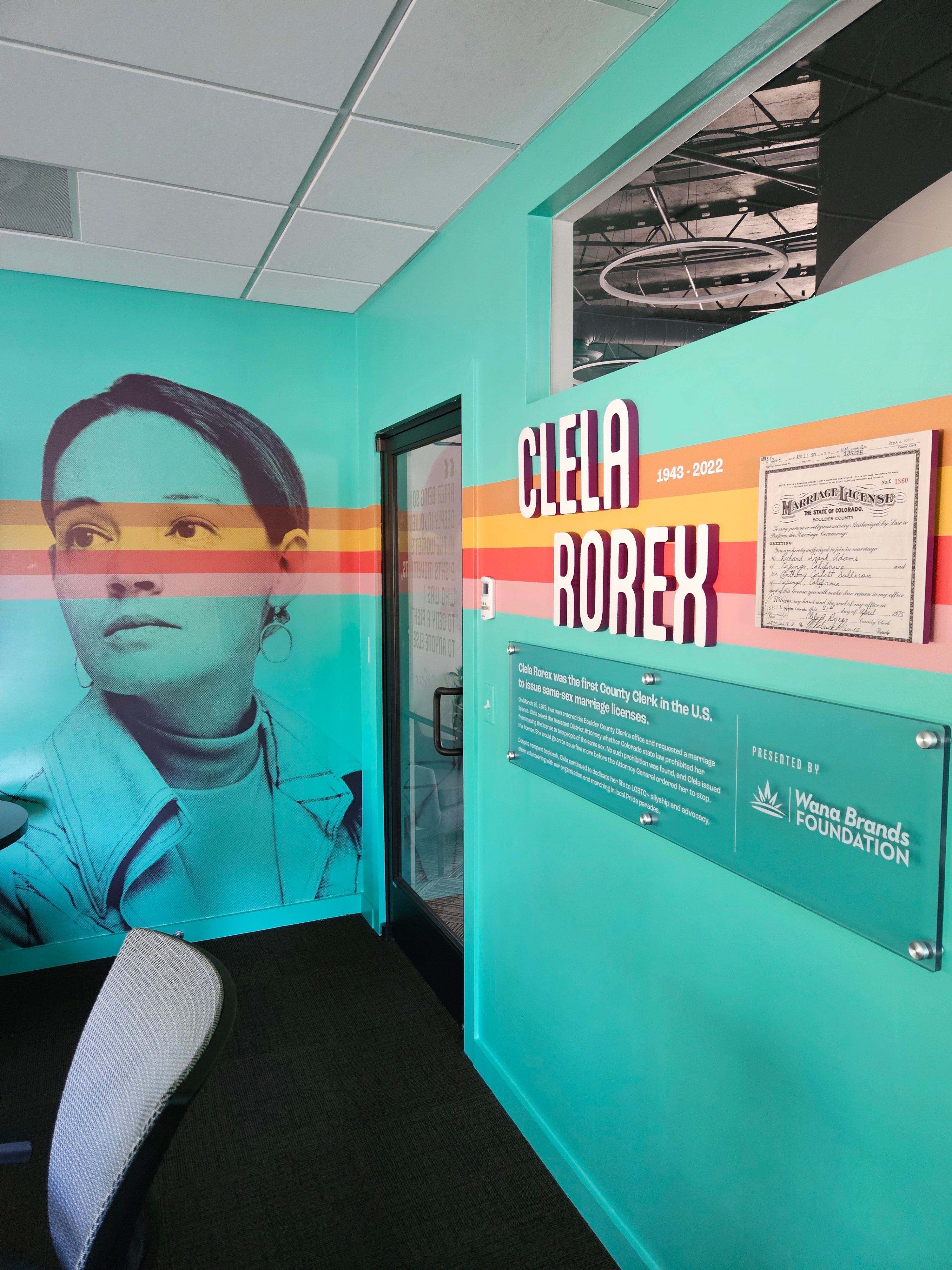 The Clela Rorex conference room at Rocky Mountain Equality in Boulder, Colorado, with acrylic signs and wall vinyl wraps.