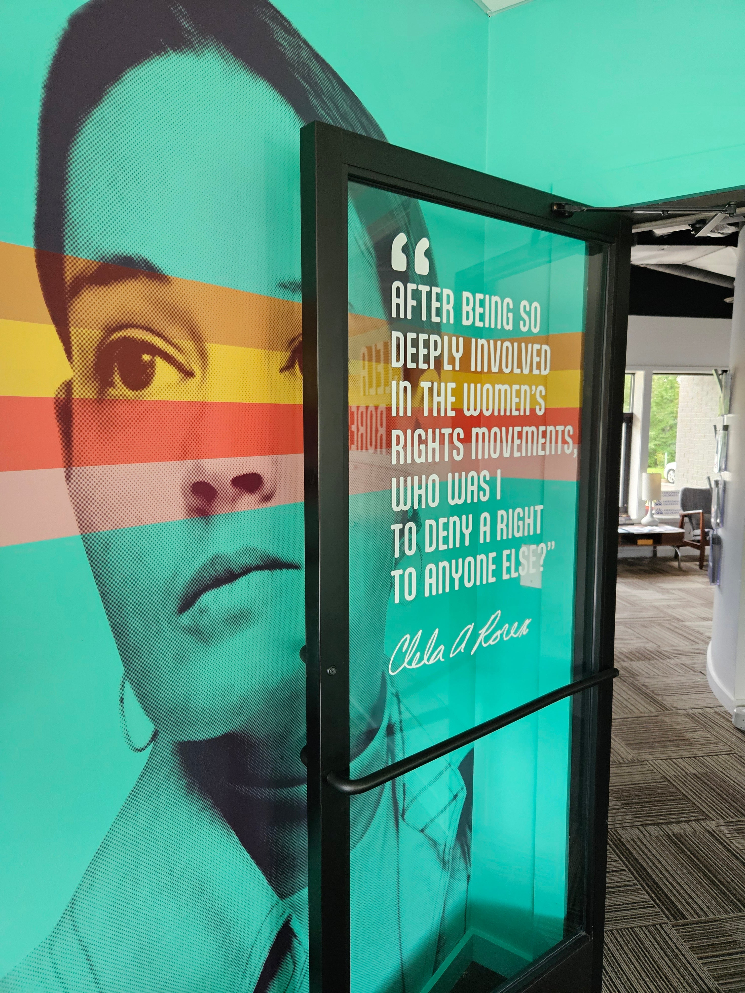 The Clela Rorex conference room paired with window and wall vinyl wraps at Rocky Mountain Equality in Boulder, Colorado.