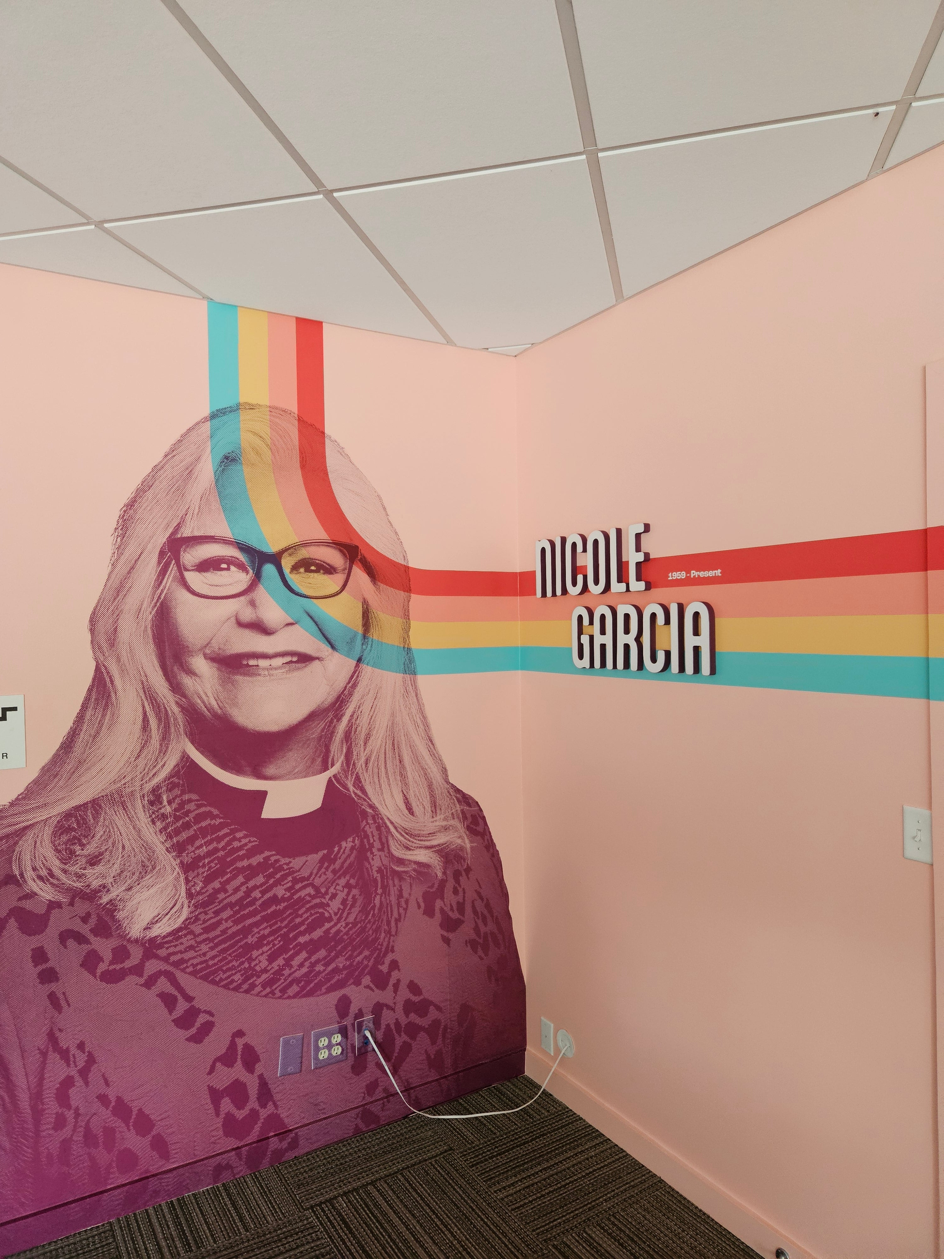 Rocky Mountain Equality's Nicole Garcia room, brought together with some acrylic lettering and wall vinyl wraps.