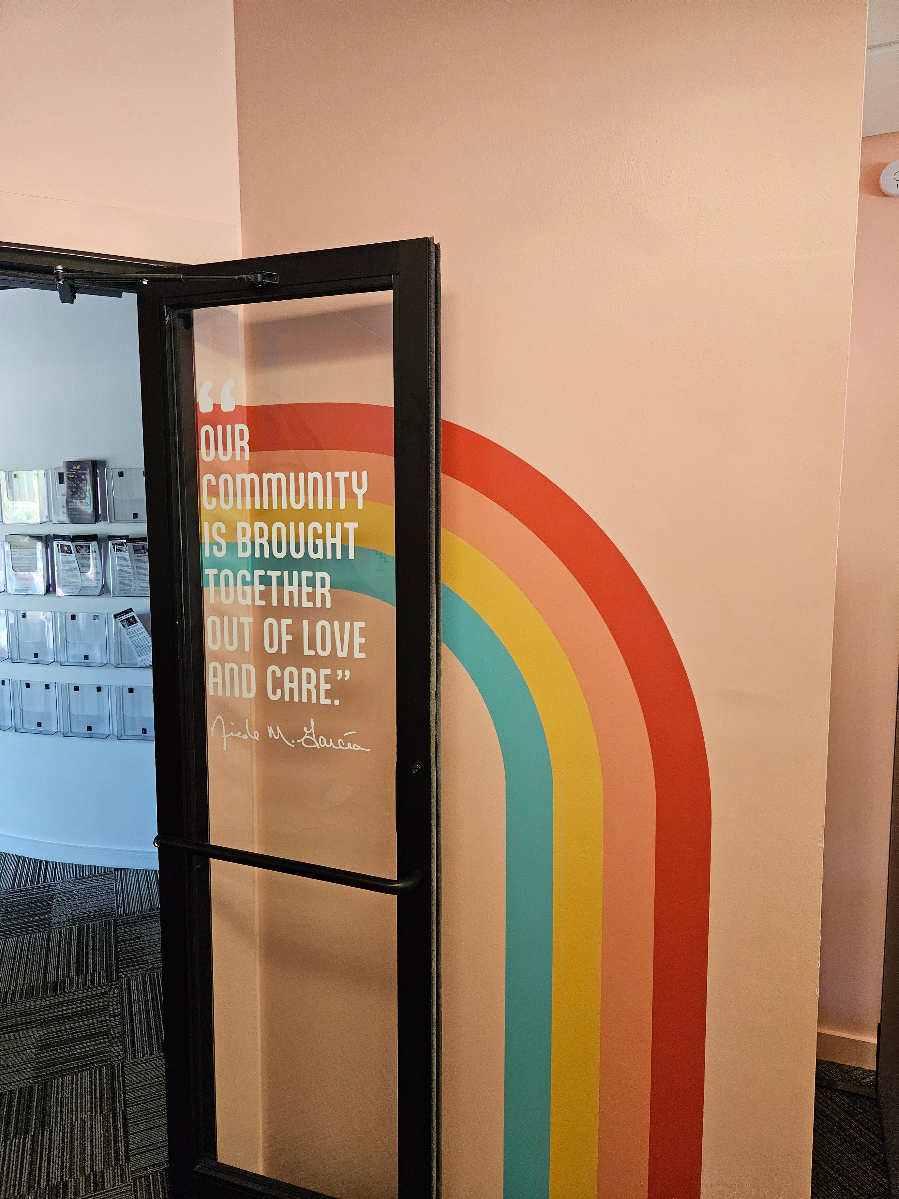 Rocky Mountain Equality's conference room door with window vinyl and an adjacent wall with a wall vinyl in Boulder, Colorado.