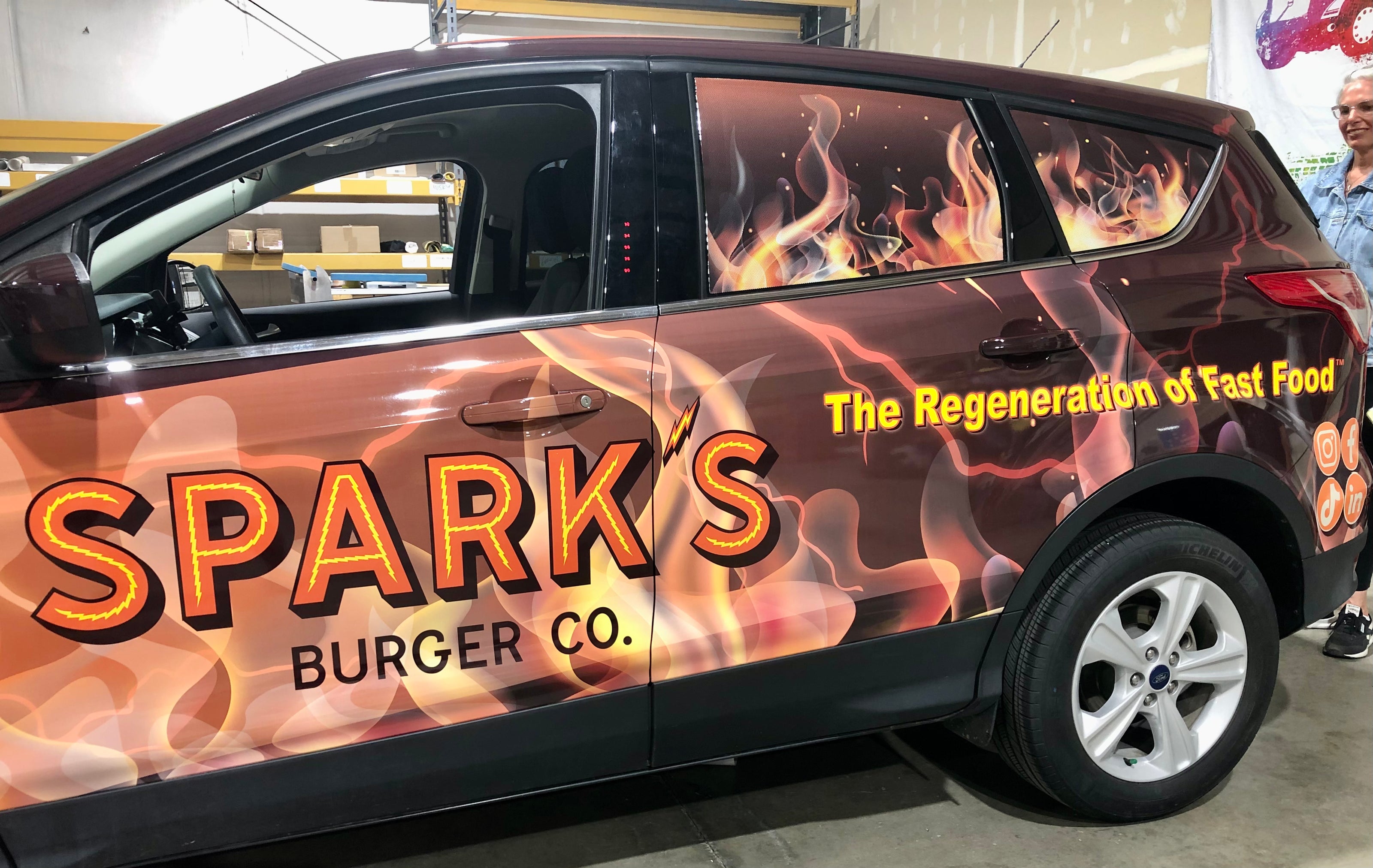 Spark's Burger Co. in Manhattan Kansas upgraded their service car by getting a full vehicle wrap with Husky Signs.