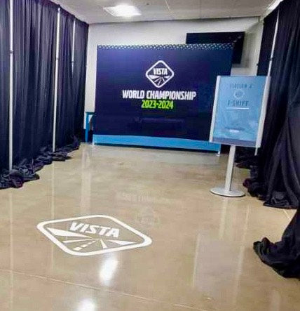 A floor vinyl wrap and an event display sign for Volvo's Vista World Championship 2023-2024 in Fort Worth, Texas.