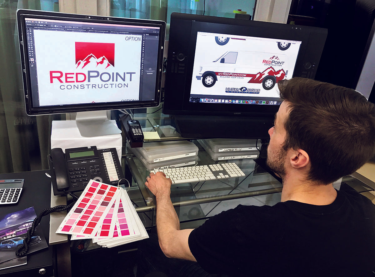 Professional Graphic Designer working on a custom made logo and vehicle wrap for RedPoint Construction in Golden, Colorado.