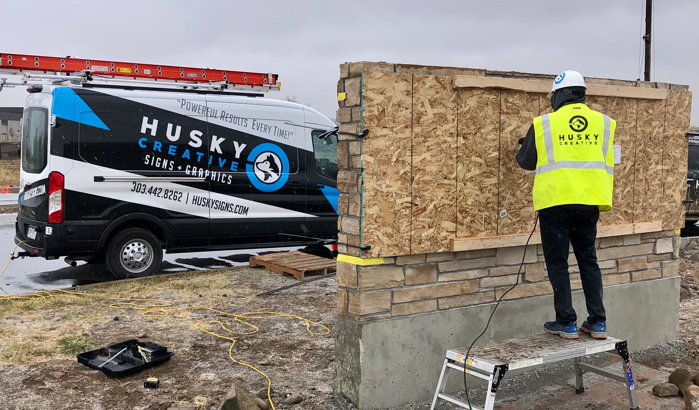 Exterior monumental signage install in progress. 