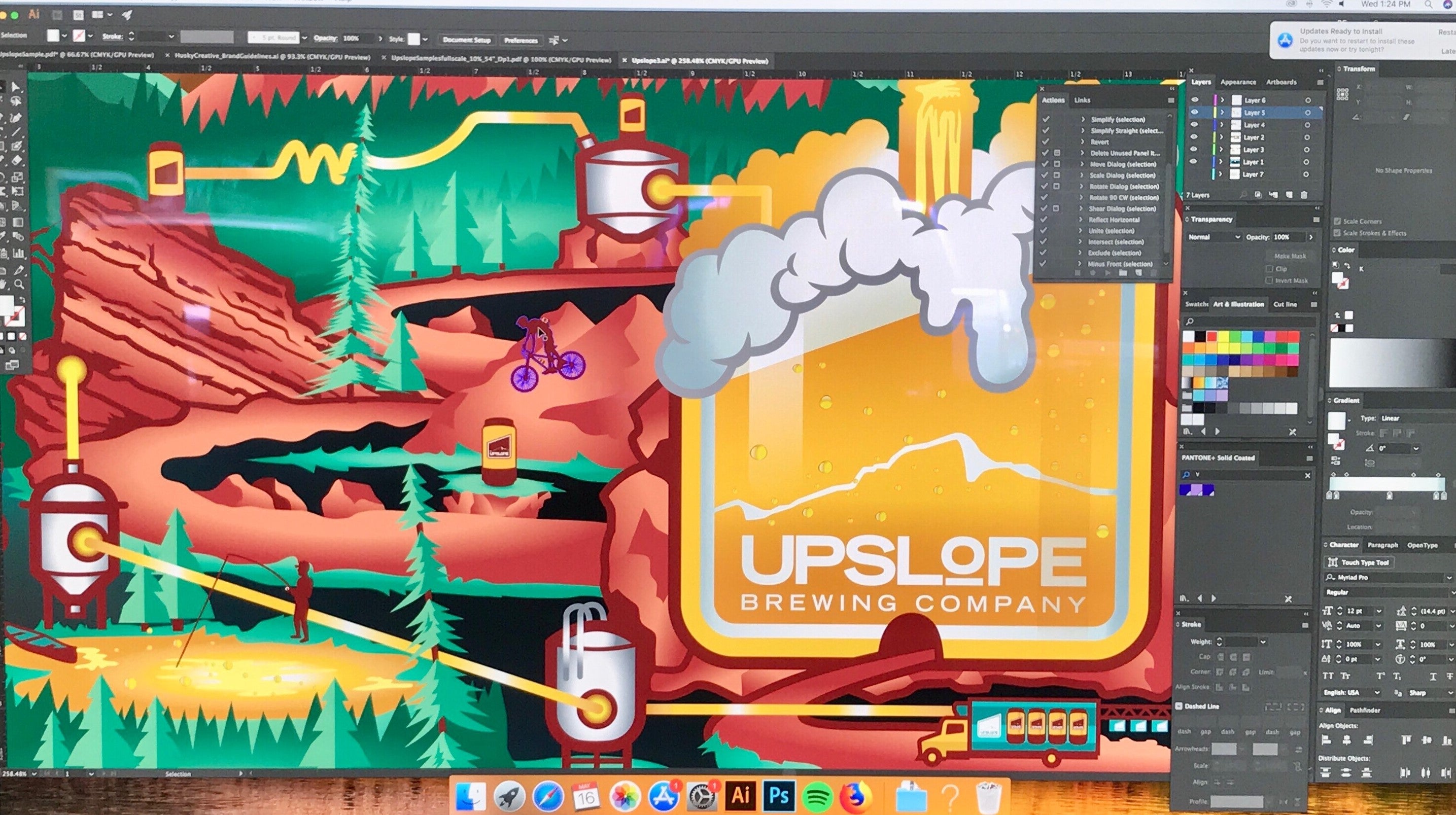 A computer screen showing a vibrant, colorful art proof for Upslope Brewing Company in Boulder, Colorado. The design includes stylized landscapes, beer cans, and the Upslope Brewing logo as part of the project.