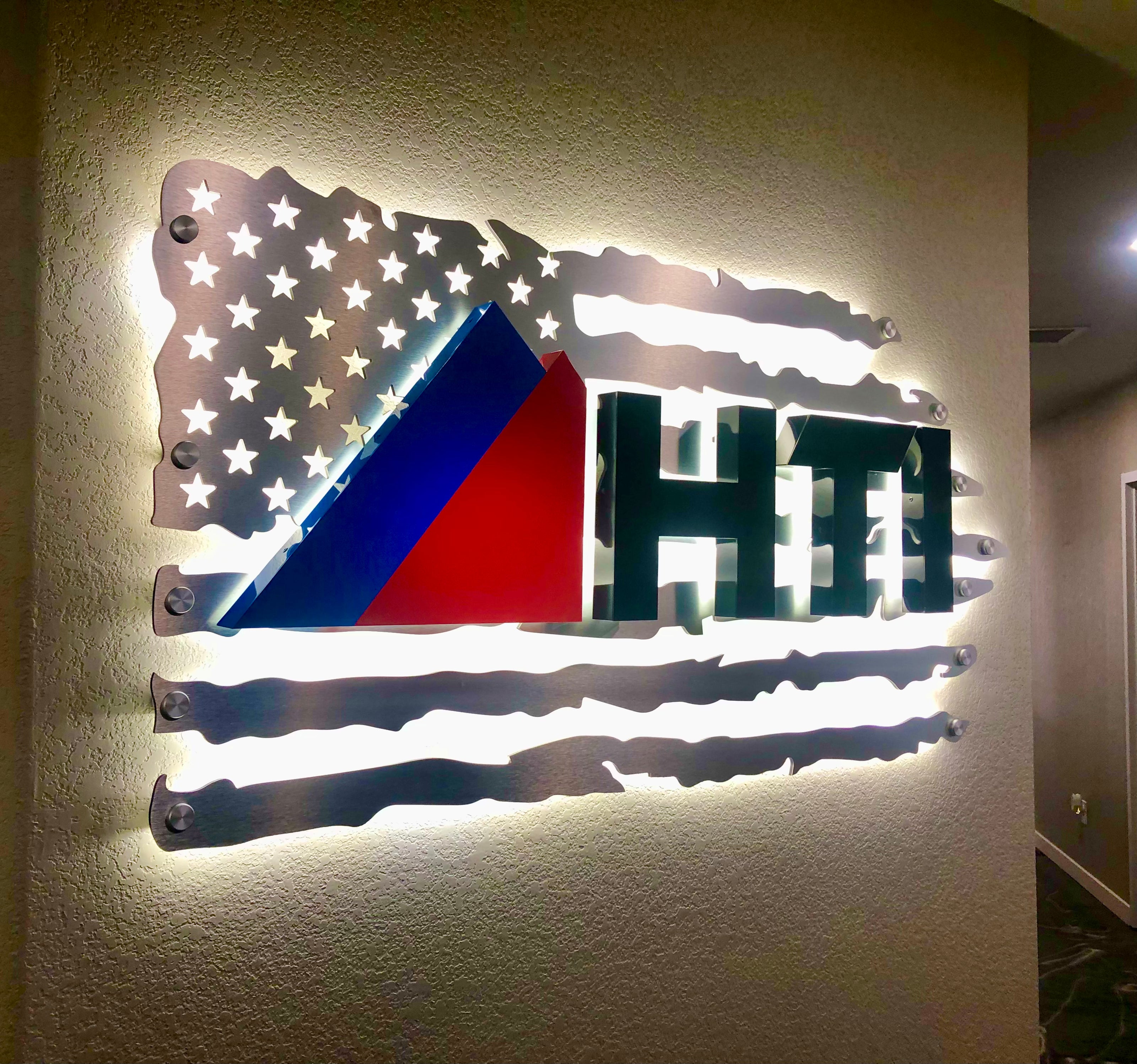 Interior fabricated business signage for HTI.