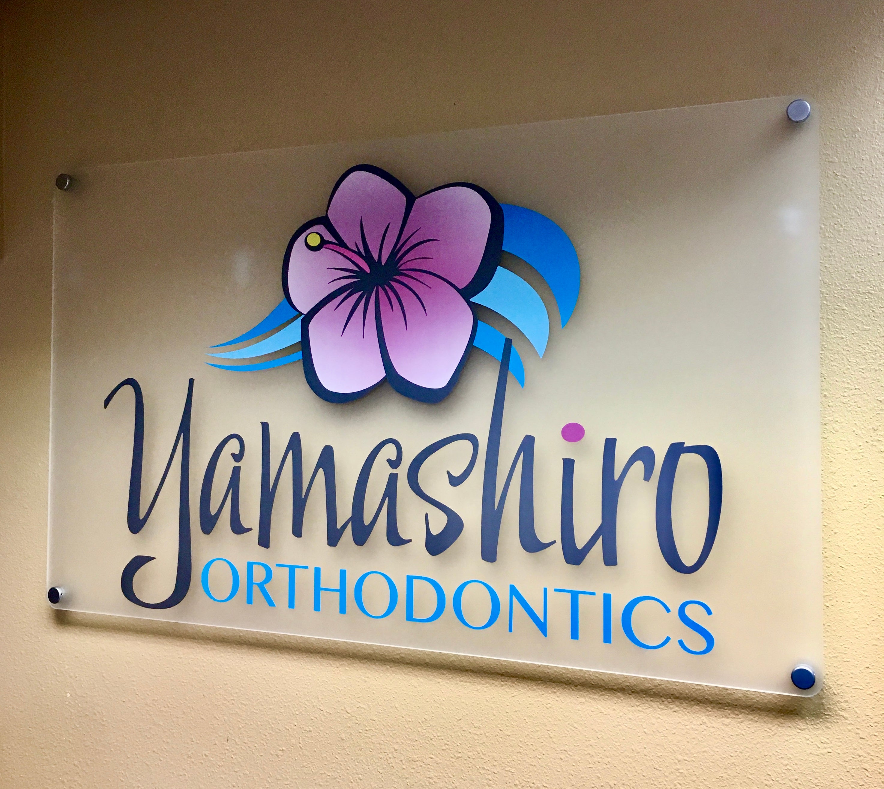 Custom designed interior signage for Yamashiro Orthodontics in Boulder, Colorado.