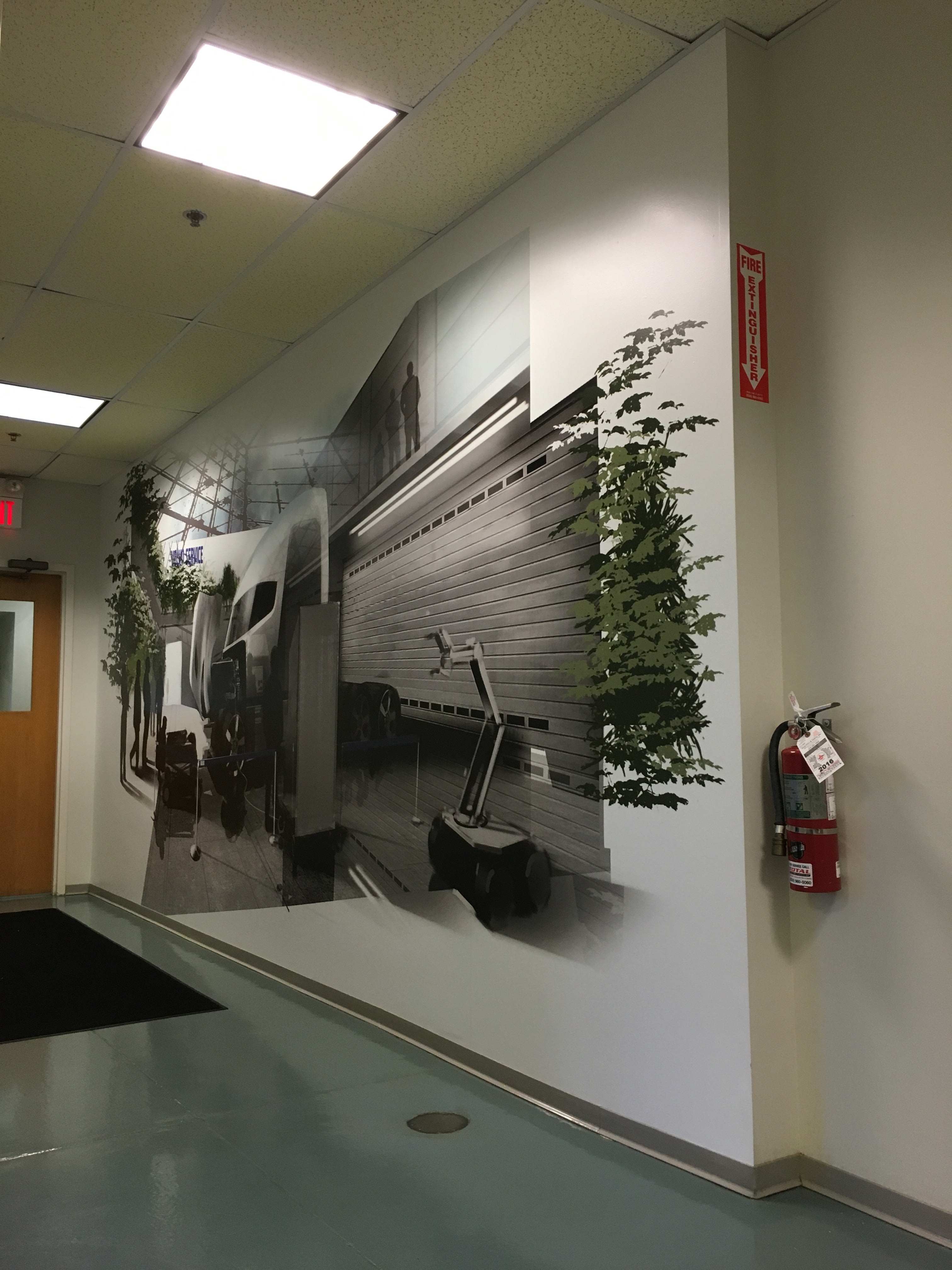 Wall wrap for Volvo Mack in El Paso, Texas, enhancing the interior space with branded graphic design.