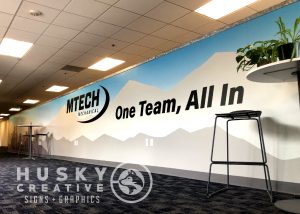 Revamp your retail space with custom wall wraps by Husky Creative, designed for maximum marketing impact