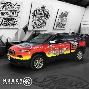 Eye-catching vehicle branding design by Husky Creative, perfect for promoting your business on the go