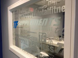 Vibrant interior window graphics by Husky Creative, enhancing retail and office spaces with captivating visuals